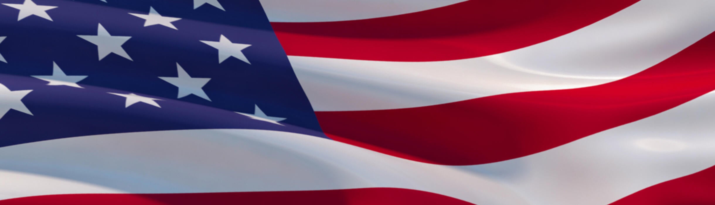 The flag of the United States flutters in the wind.